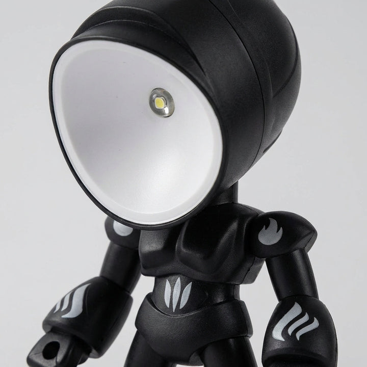 Compact robot table lamp, Luminobot, with soft LED light for kids' bedroom, great for reading & night light.