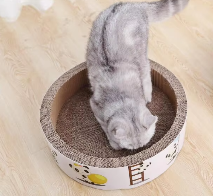 Round cat scratcher with cute design, perfect pet supplies for feline relaxation and play.