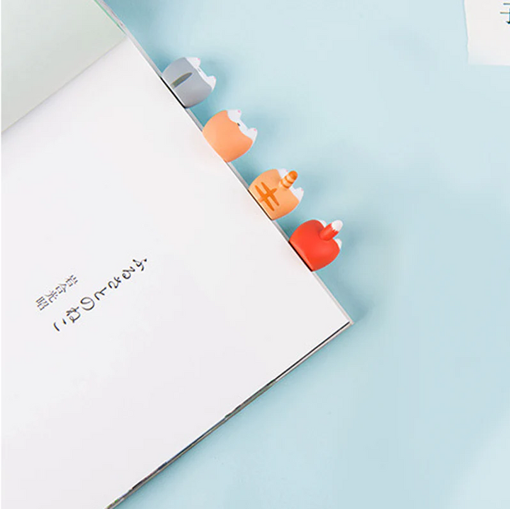 Close-up of a funny dog butt silicone bookmark, a unique reading accessory for pet lovers