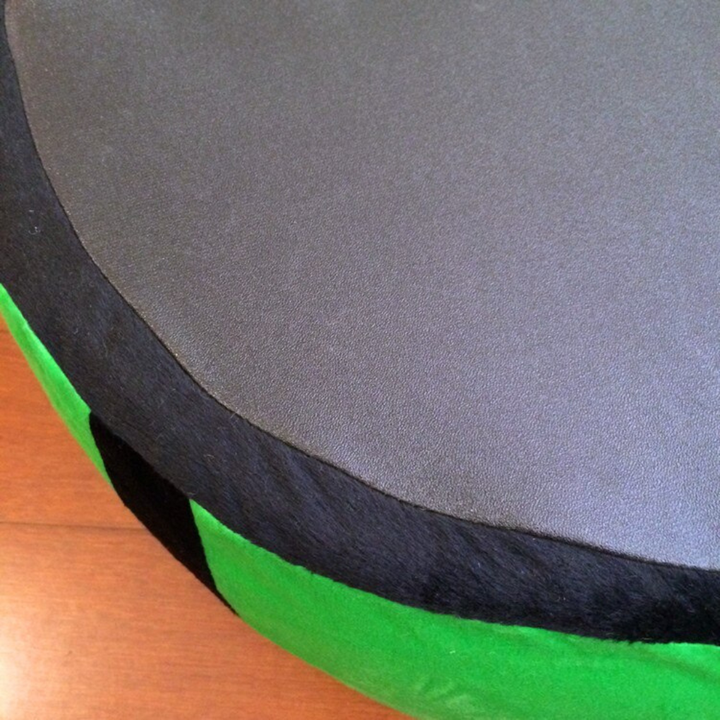 Washable pet bed shaped like a watermelon, offering a comfy and stylish spot for cats to sleep.