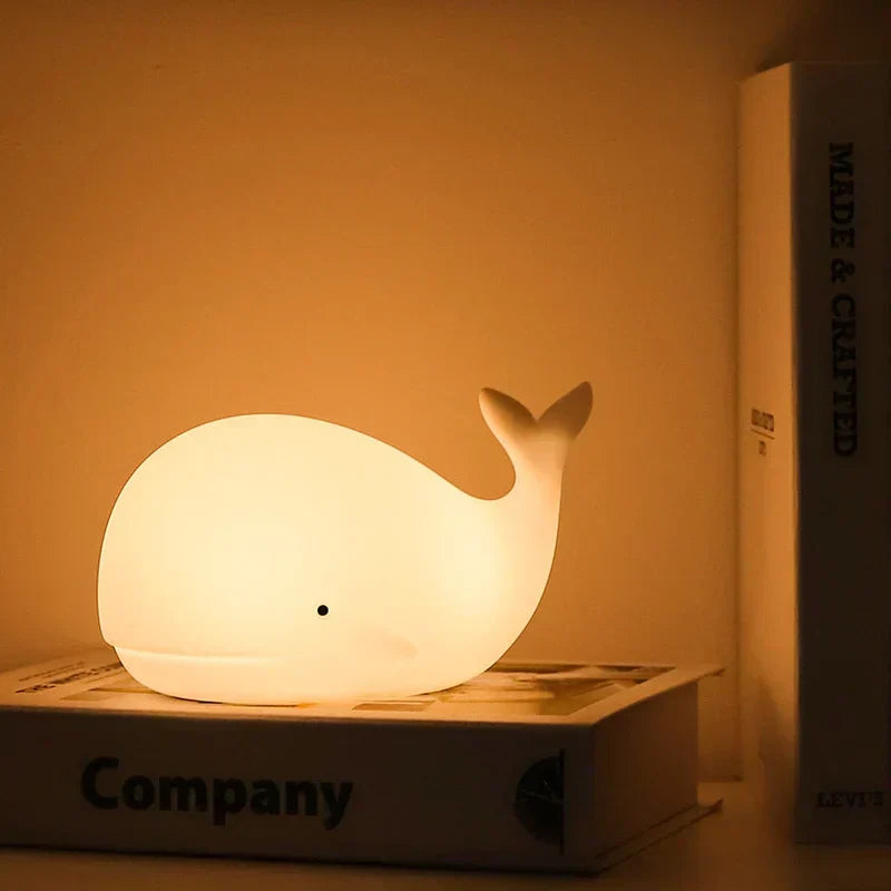 Cute whale night light for kids' room, with a gentle color-changing LED glow.