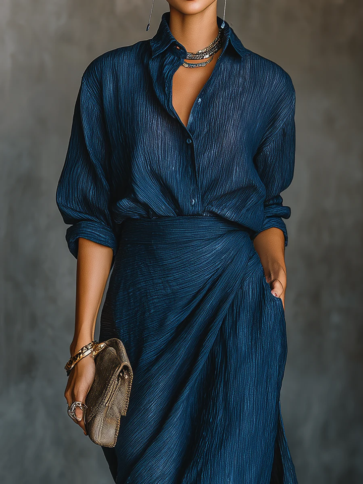 Elegant dark blue women's shirt and long skirt set, perfect for sophisticated formal wear or casual chic occasions.