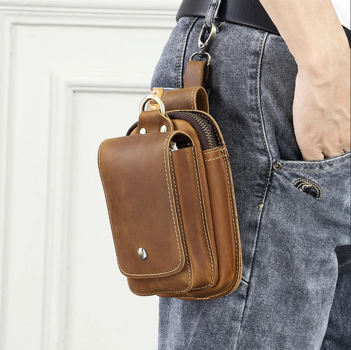 Durable dark brown men's belt pouch worn on a belt, for easy access to phone, keys, and cards.