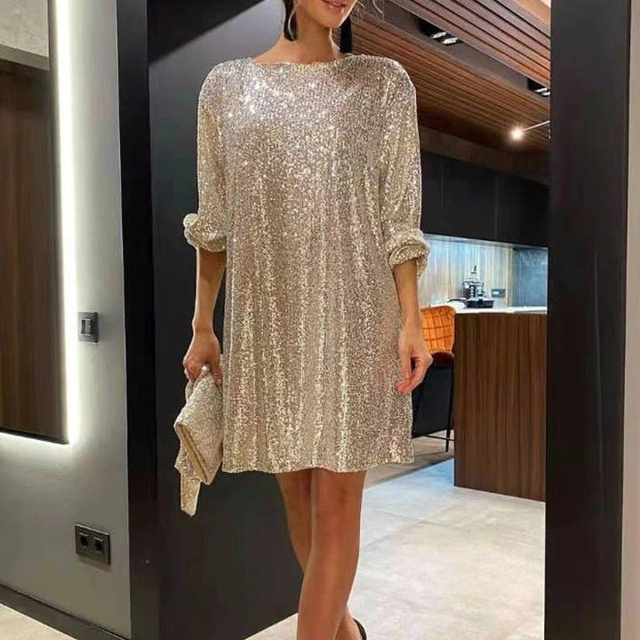 Shimmering purple sequin party mini dress. Loose fit, perfect for special occasions & holiday fashion.