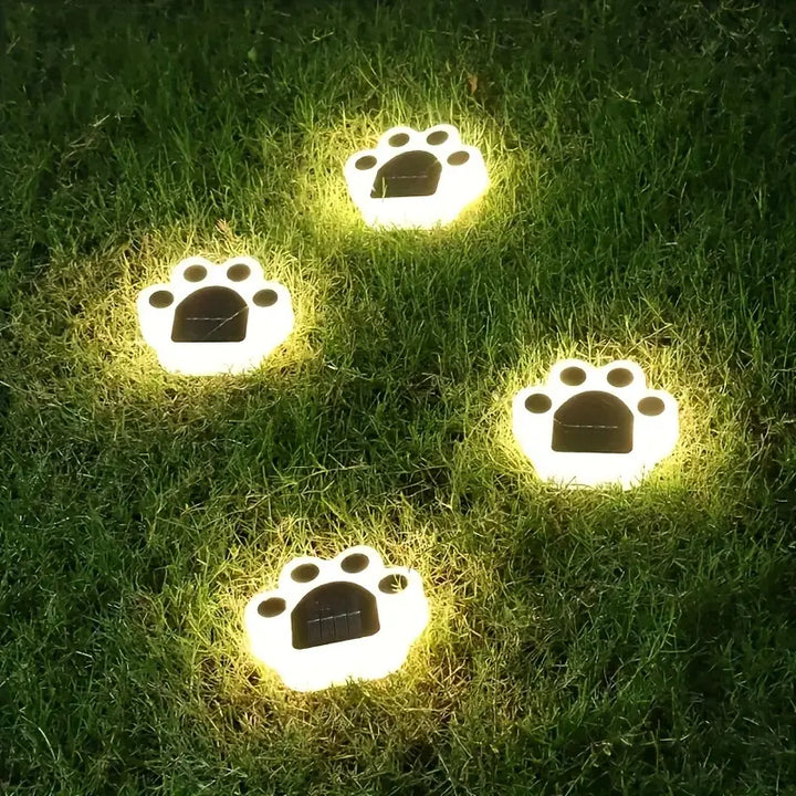 Decorative paw print solar garden lights, perfect for outdoor pathway illumination and patio decor