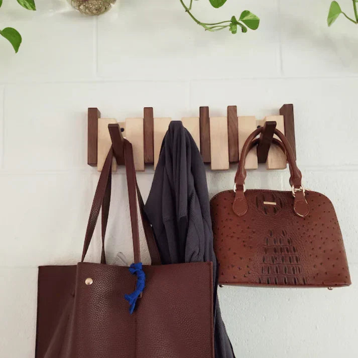 Modern piano key coat rack, elegant wall mounted home decor for organized entryways & hallways.