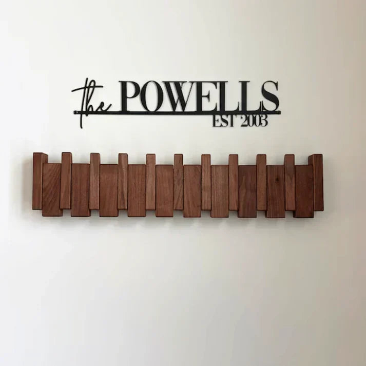 Functional piano key coat rack, a modern wall mounted home organization & entryway decor solution.