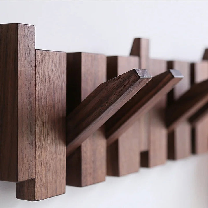Hallway organizer: Wall mounted piano style coat rack with multiple decorative hooks for coats, hats.