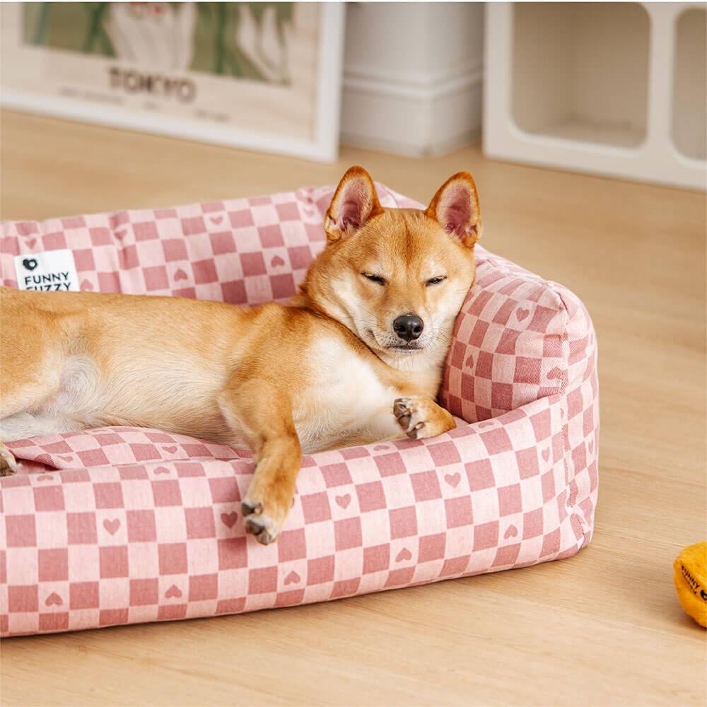 Deep sleeping dog sofa bed with reversible plaid mat for ultimate pet comfort