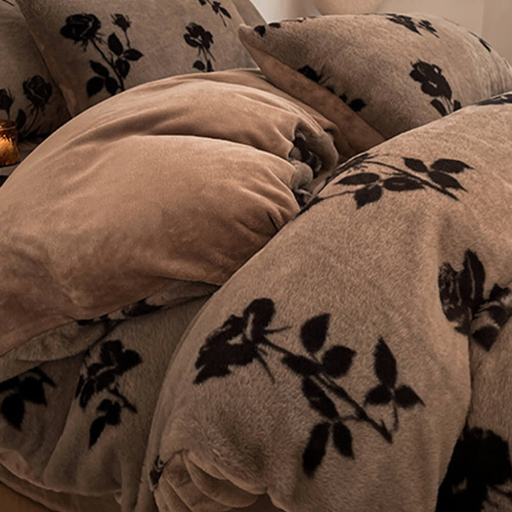 Close-up of a plush velvet sheet showing detailed floral embroidery and rich texture