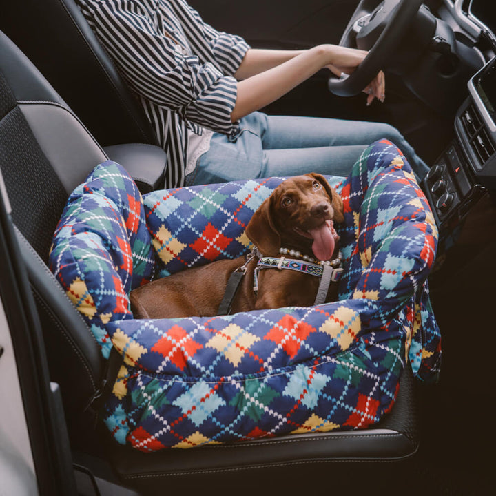 Denim dog car seat with raised bolster and ample storage, a perfect pet travel accessory.