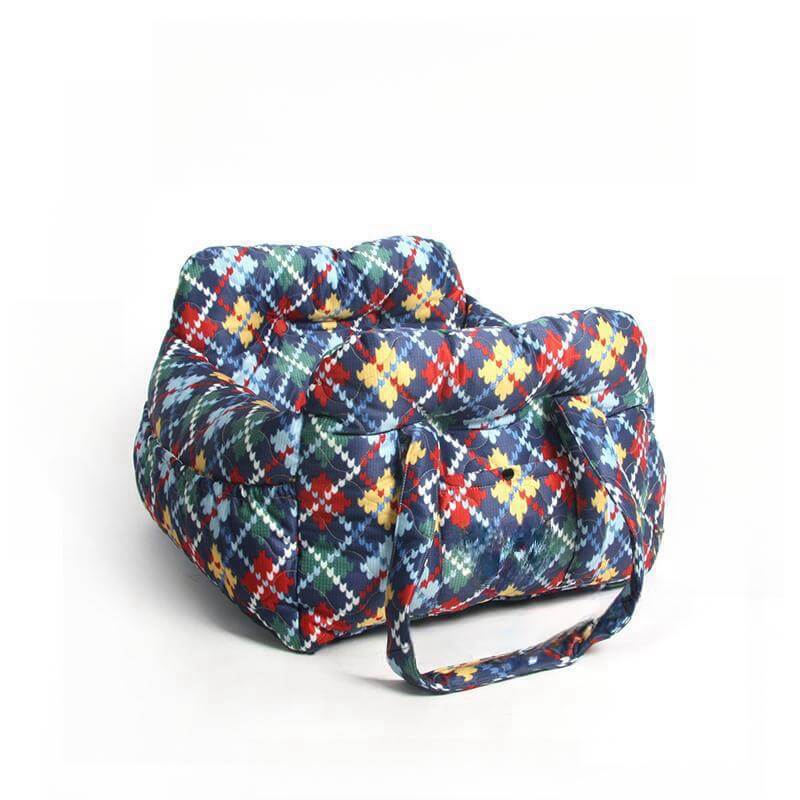 Denim dog car seat featuring a cozy bolster and storage, ensuring safe and happy pet travel.