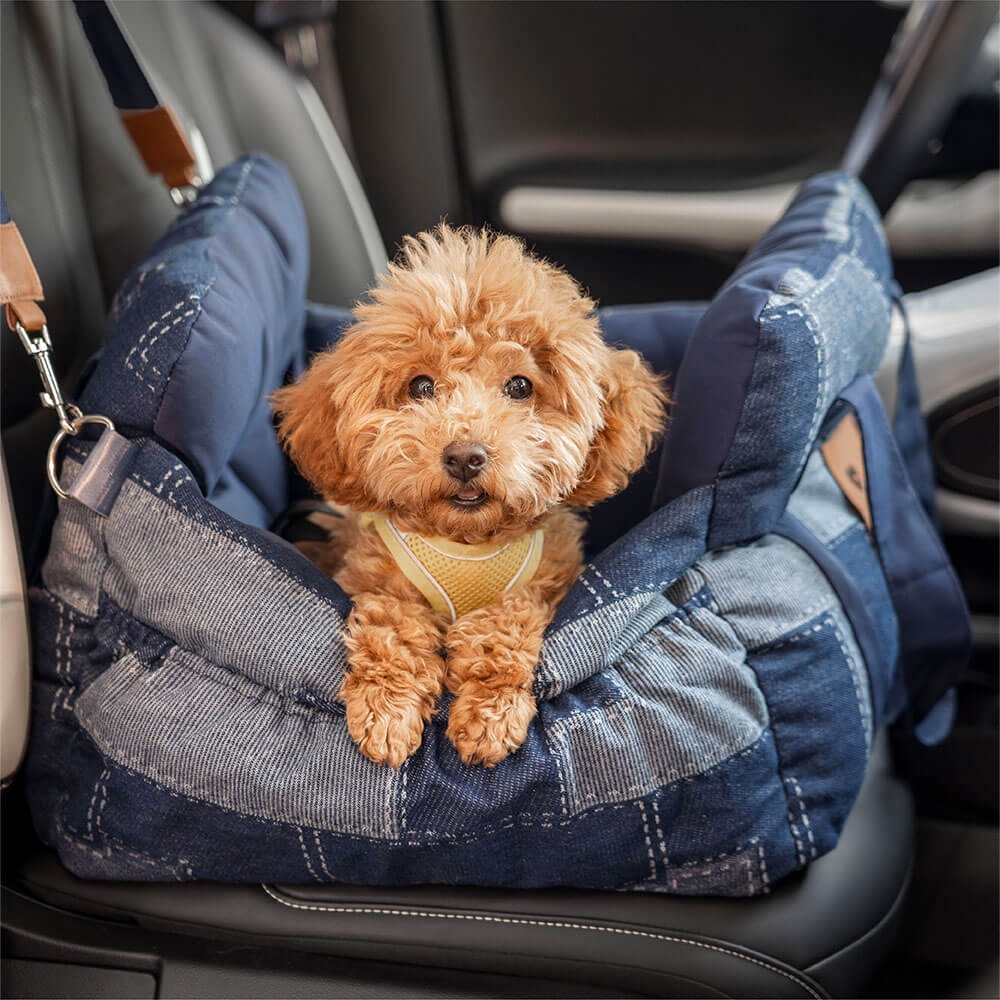 Portable dog car seat with non-slip base and bolster, ensuring pet safety during travel.