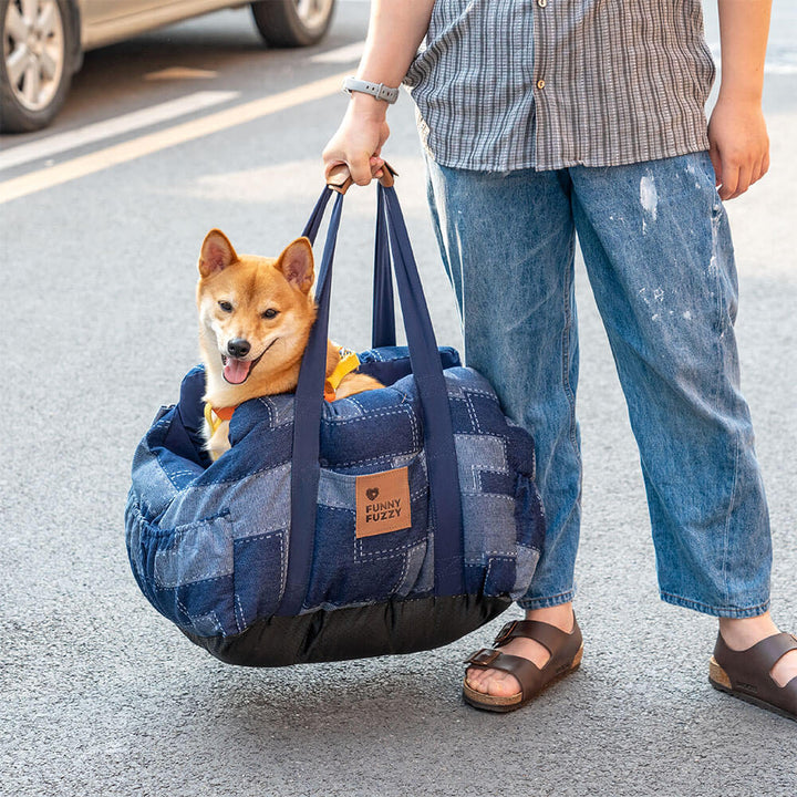 Water-resistant denim dog car seat booster for safe and comfortable pet travel, with storage.