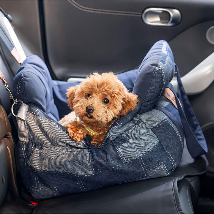 Dog car seat booster denim with integrated safety bolster, ideal for small dog travel.