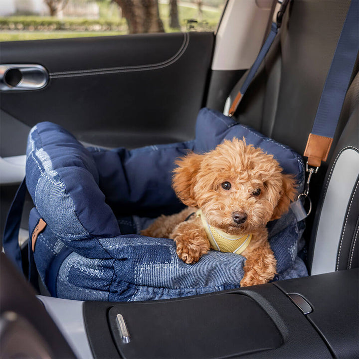 Dog car booster seat with bolster in durable denim, portable and water-resistant for travel.