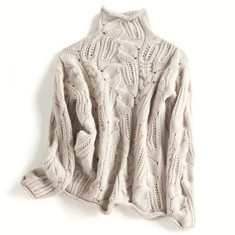 Close-up of a women's Aurora wavy knit turtleneck sweater, showcasing its unique texture and cozy knitwear design.