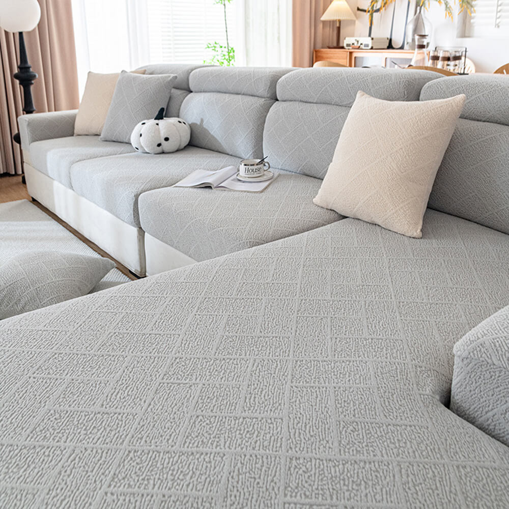 Diamond Jacquard Plush full-cover stretch sofa protector in a living room, elegant and pet-friendly
