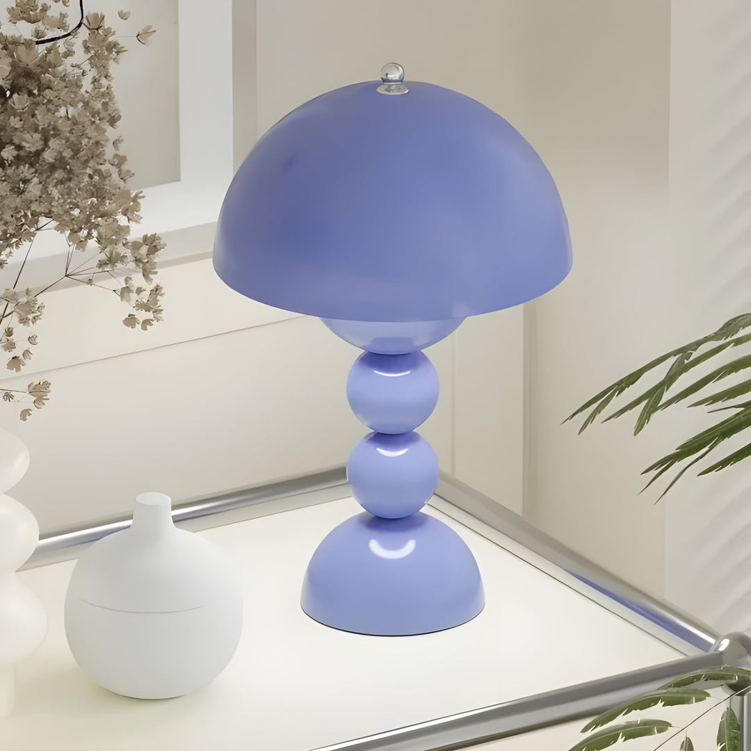 Elegant dimmable LED table lamp with a contemporary flower bud design.