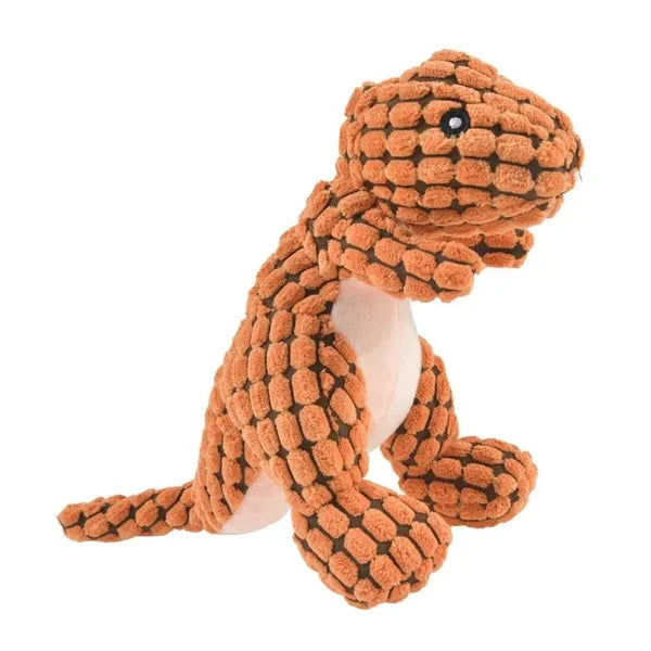 A dog's new green dinosaur plush chew toy. Durable, eco-friendly pet toy designed for interactive play.