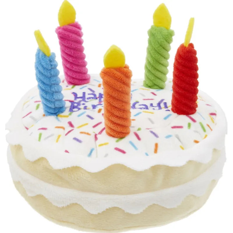 Assorted plush squeaky dog toys for birthday parties, featuring cake, cupcake, and bone designs