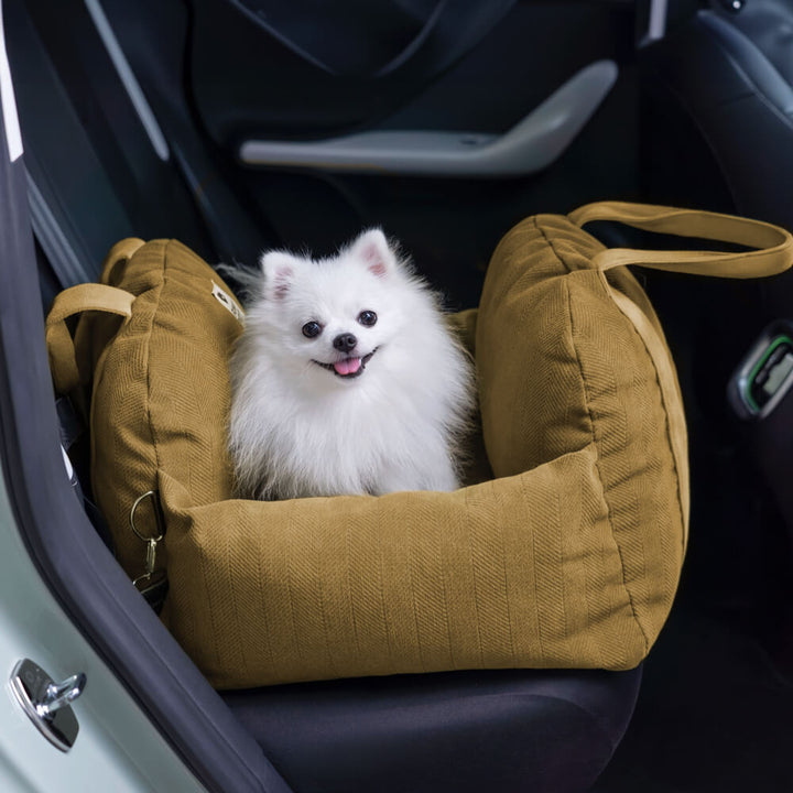 Washable cover on a dog bolster car seat, showing easy maintenance for pet travel bed