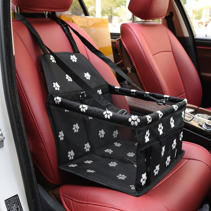 Dog booster car seat for small pets, featuring a plush lining and safety straps.