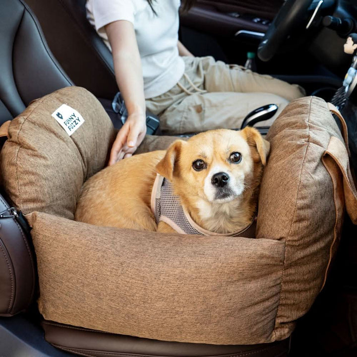 Soft, washable fabric of a dog car seat with non-slip base and safety belt for travel.