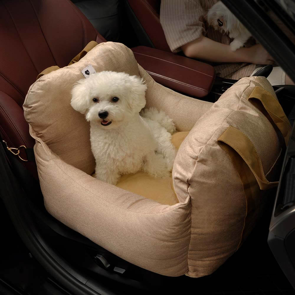 Comfortable dog car seat booster, black, with secure straps, perfect for pet travel safety.