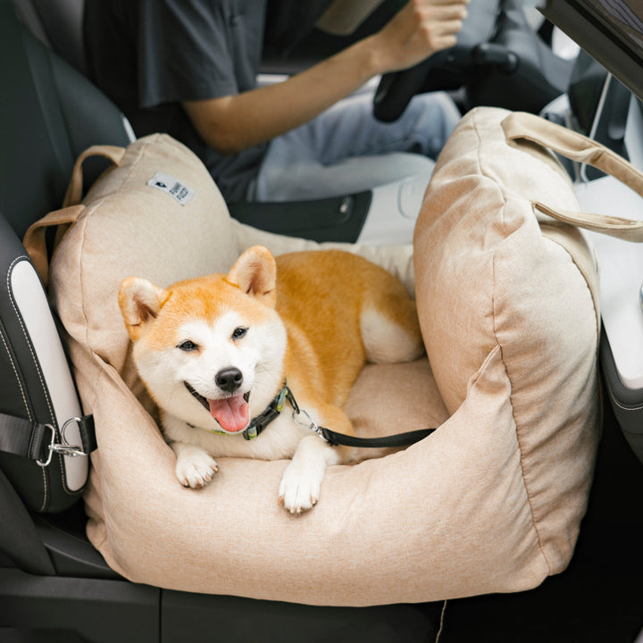 Dog car seat booster, red, eye-catching design, enhances pet visibility.