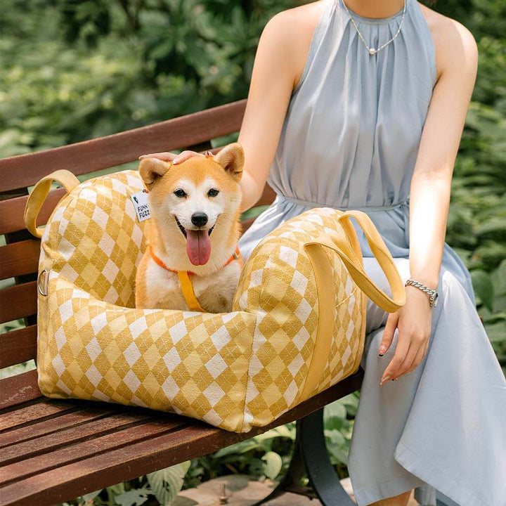 Dog car seat booster, tan, blends with car interior, stylish pet accessory.