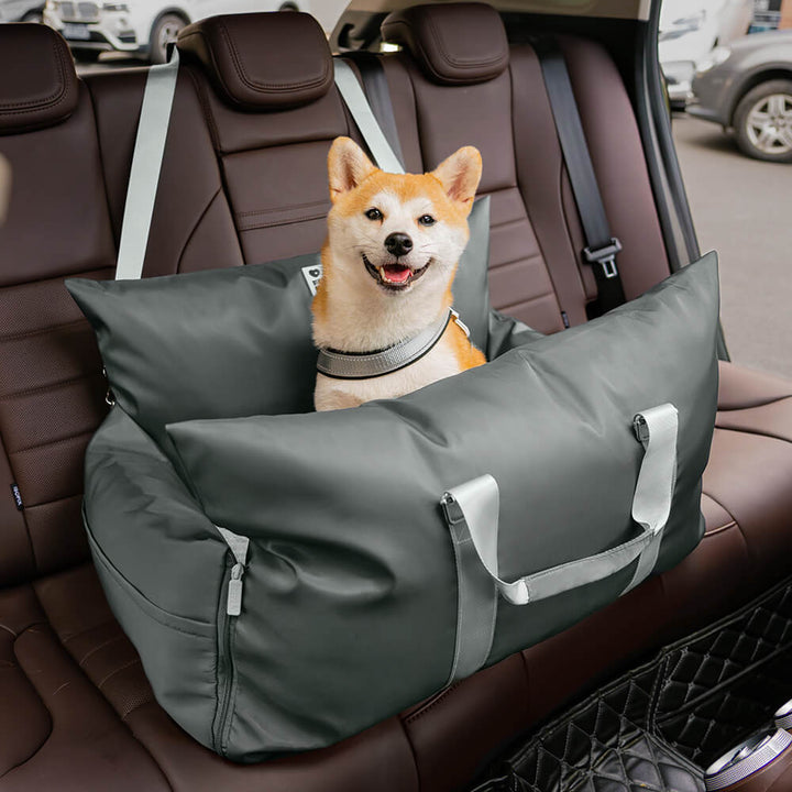 Small dog booster bed for car, with headrest strap for secure fit.