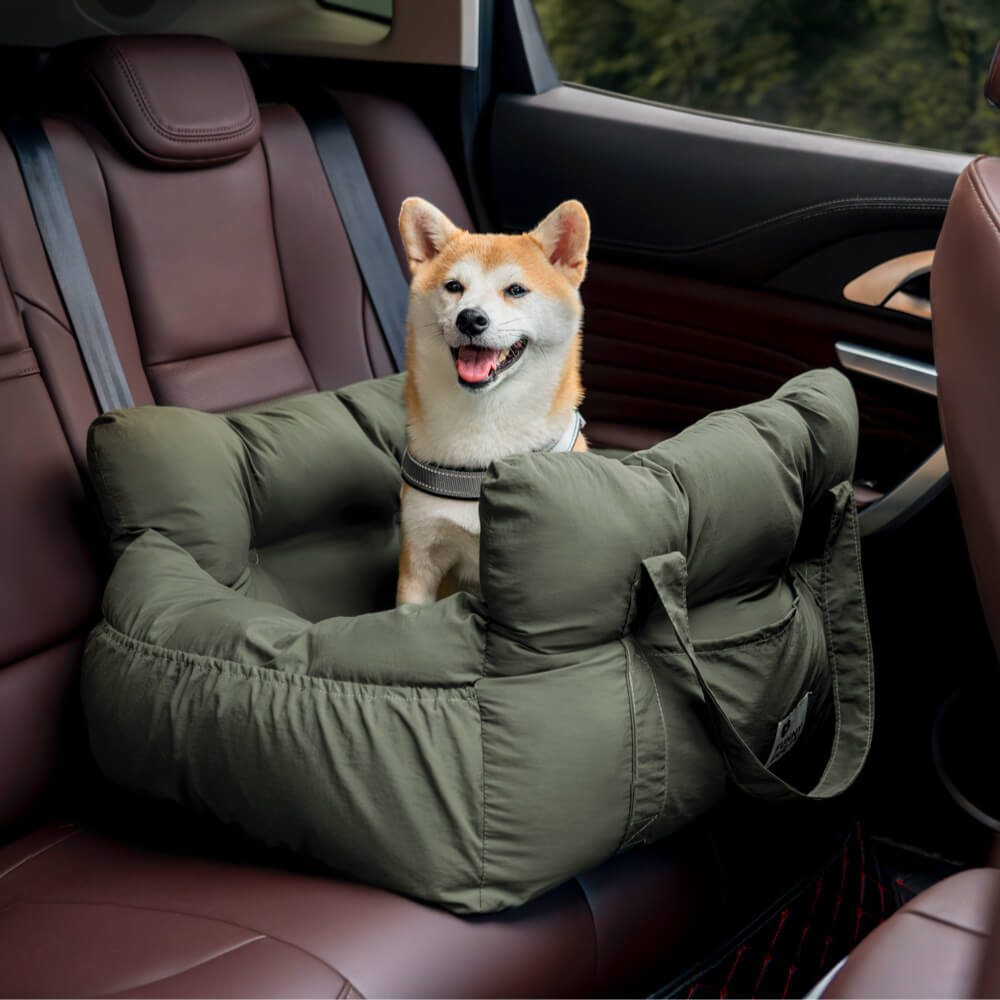 Dog travel booster, dark grey, with car seatbelt pass-through slots.