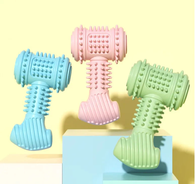 Dog chewing on a blue dumbbell dental toy, promoting teeth cleaning and oral health.