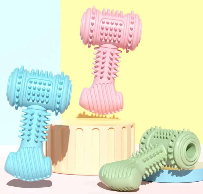 Dog enjoying an interactive dumbbell toy, showing its use as a dental care chew for pets.