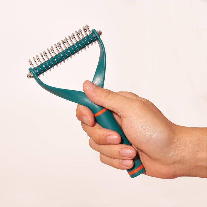 High-quality pet deshedder, a double-bladed dematting comb for easy and efficient dog care.