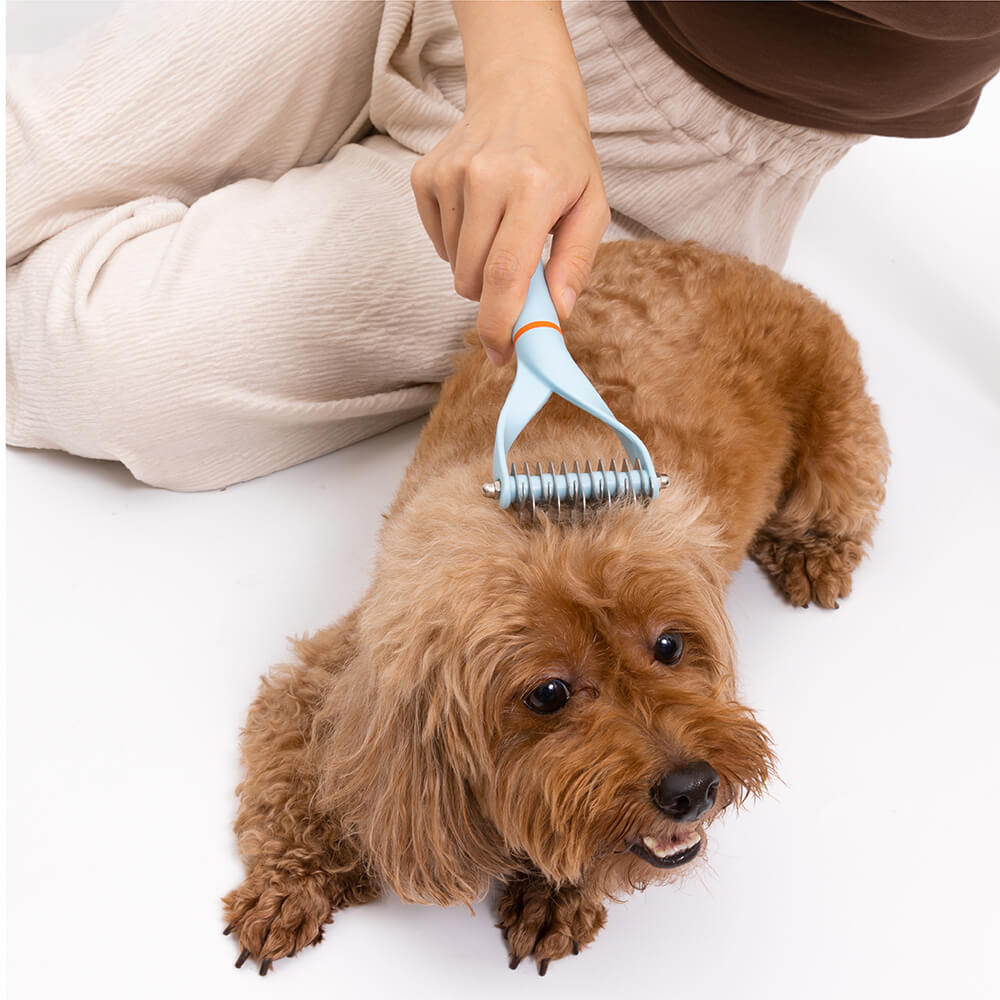 Versatile double-sided dematting comb, an essential grooming tool for removing dog tangles and mats.