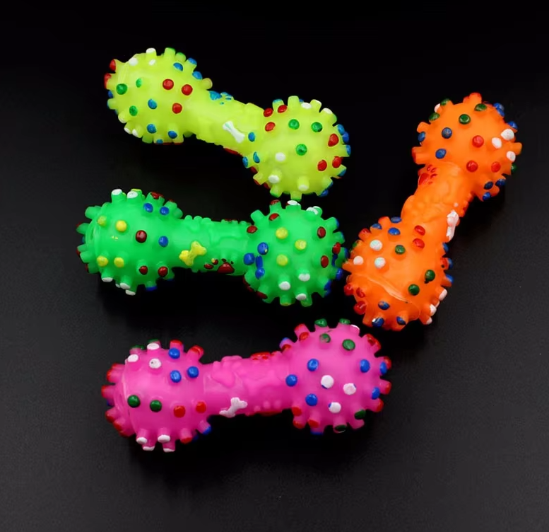 Close-up of a rubber dog dumbbell toy designed for dental hygiene and play.