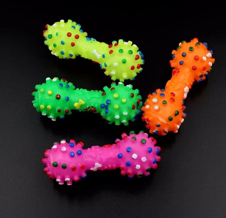 Close-up of a rubber dog dumbbell toy designed for dental hygiene and play.