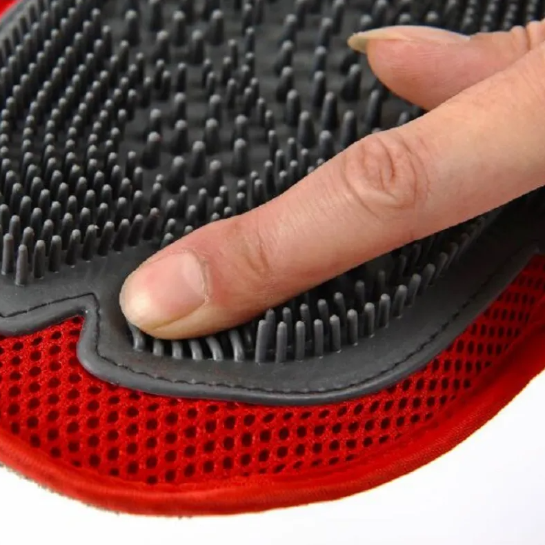 Durable black dog bath glove with nubs, a pet care massage brush for effective grooming and hygiene.
