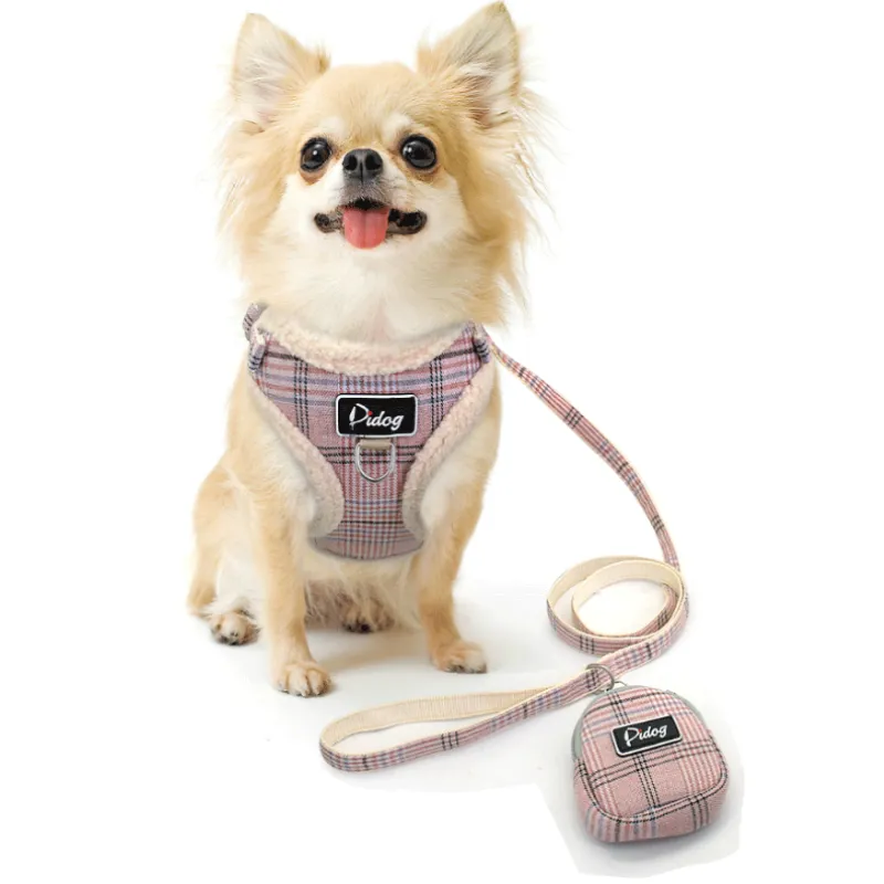 Dog harness set with black and white checked pattern, comfortable for small to medium dogs, includes leash and waste bag dispenser.
