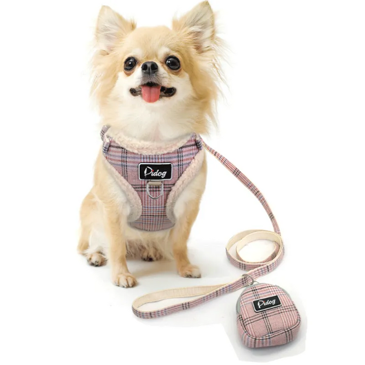 Dog harness set with black and white checked pattern, comfortable for small to medium dogs, includes leash and waste bag dispenser.
