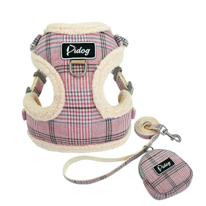 Durable dog harness and leash in checked print, includes waste bag dispenser, ensuring comfortable and clean dog walks.