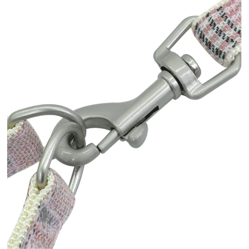 Pet supplies: Checked dog harness with matching leash and quick-access waste bag dispenser, perfect for pet owners on the go.