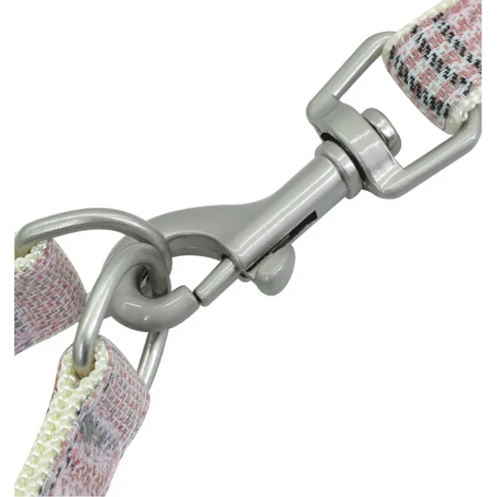 Pet supplies: Checked dog harness with matching leash and quick-access waste bag dispenser, perfect for pet owners on the go.