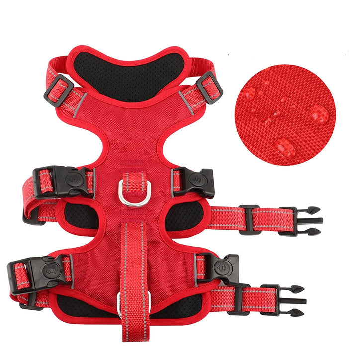 Black dog harness featuring a convenient handle and reflective stitching, perfect for walks and training