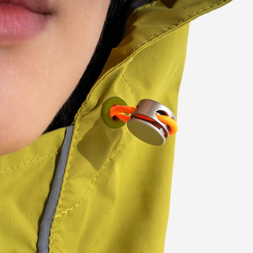 Close-up of waterproof zipper on a matching human raincoat, showing quality and protection from elements