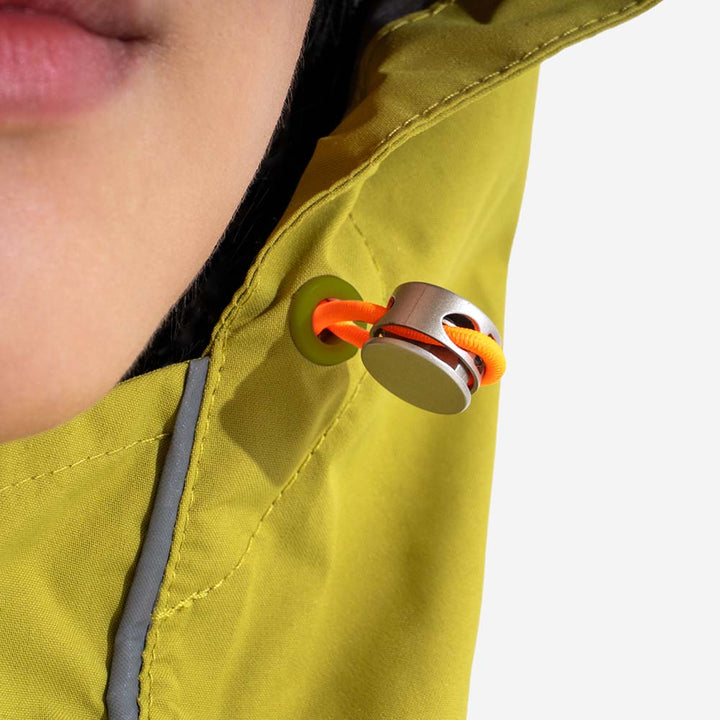 Close-up of waterproof zipper on a matching human raincoat, showing quality and protection from elements