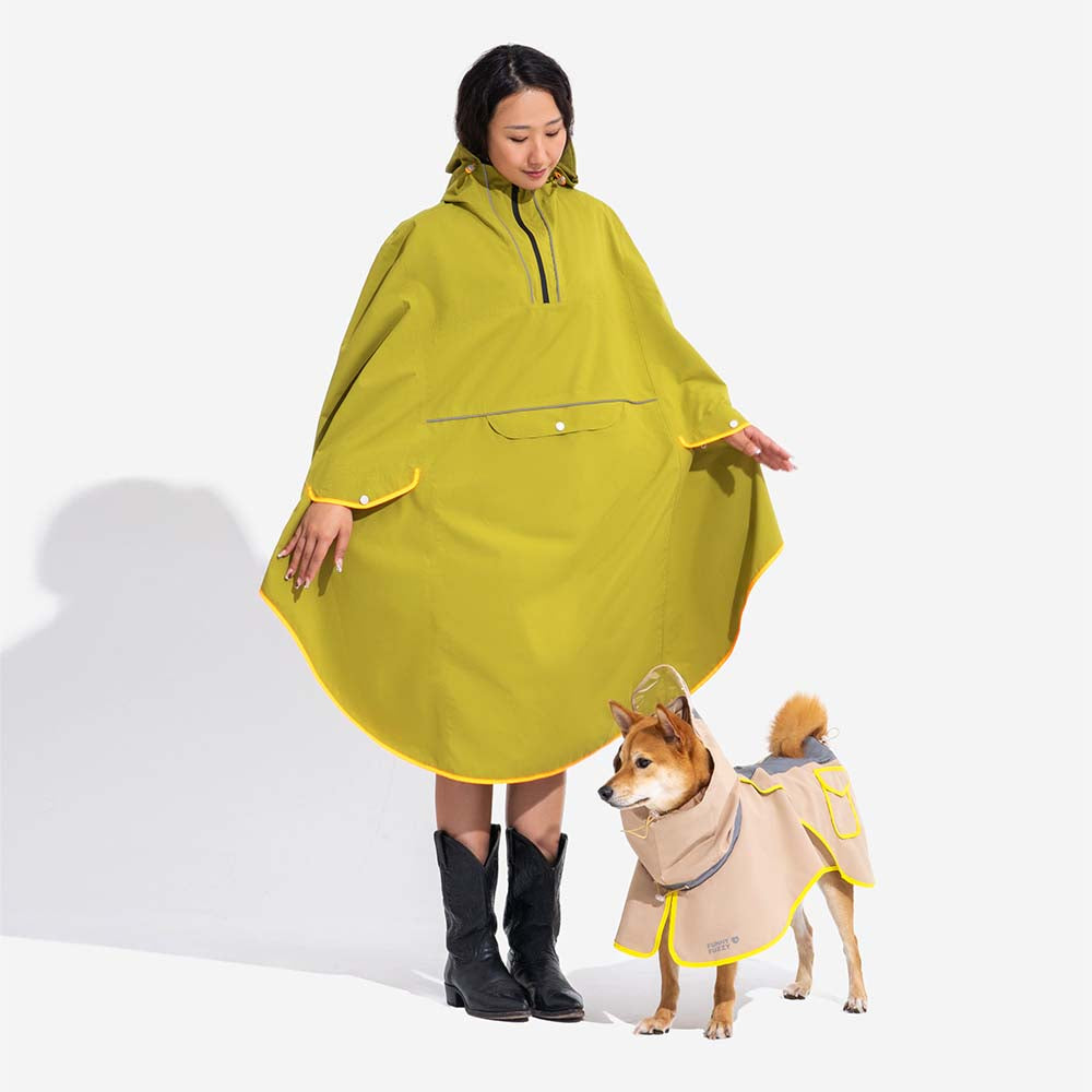 Reflective stripe detail on an adjustable dog raincoat, enhancing safety during night walks and low visibility
