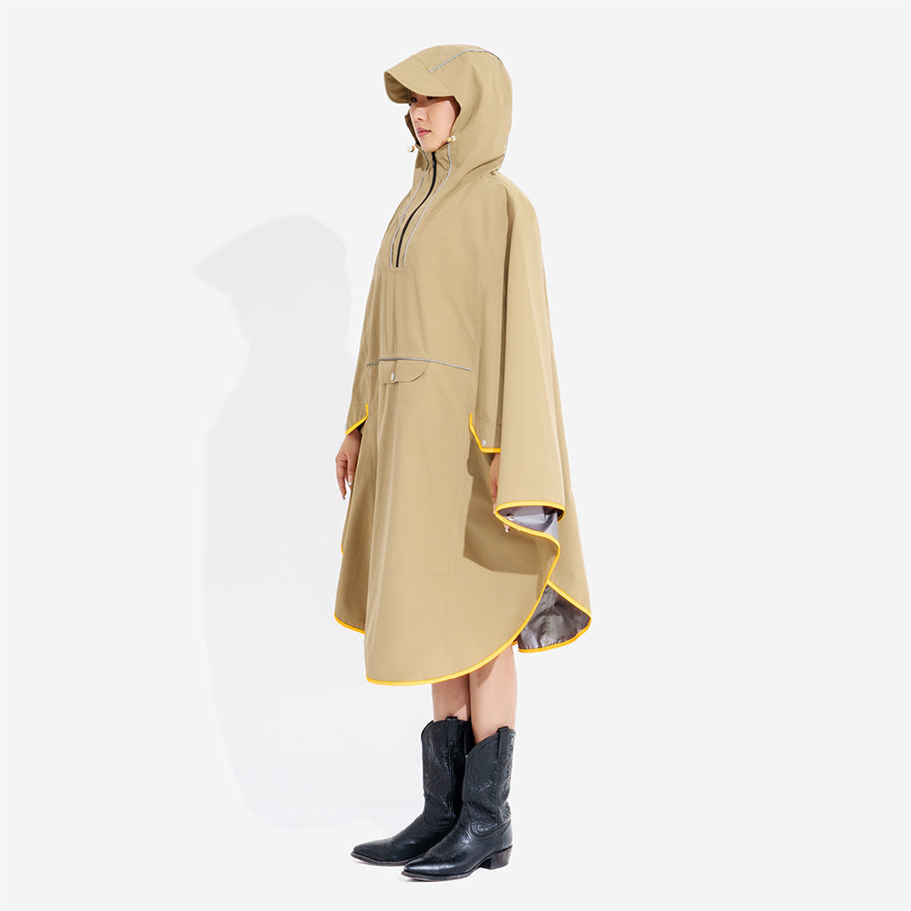 Front view of a human model in a matching yellow waterproof raincoat, standing beside their dog, outdoor wear